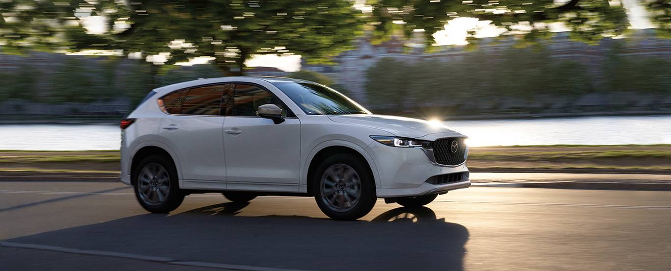 white mazda cx-5 driving