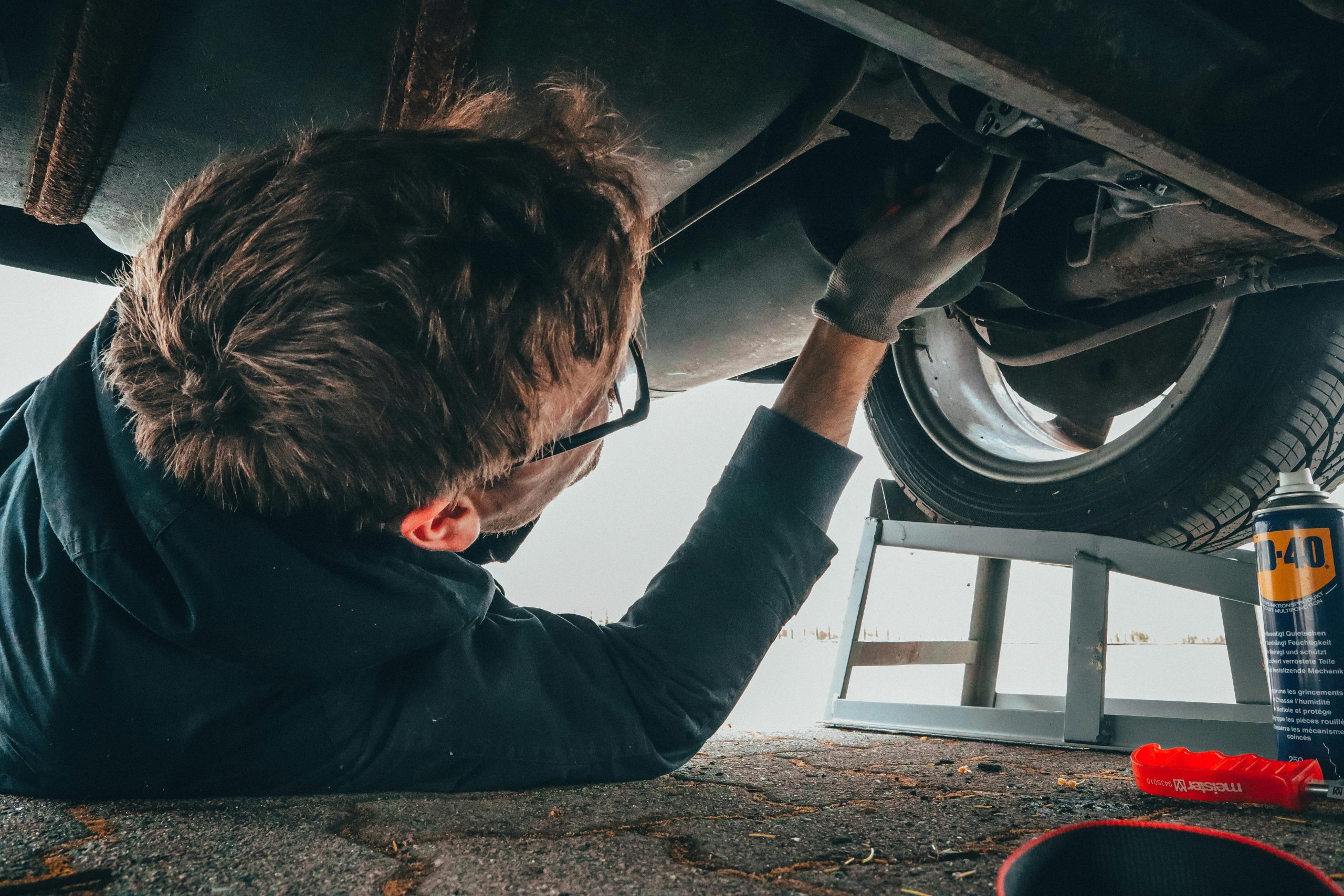 A man doing a repair on a car