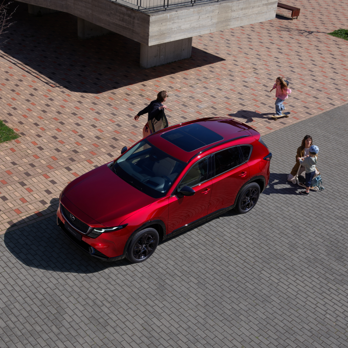 family loading up in the mazda cx-5